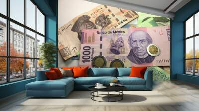 Mexican peso bills spread over white background Wall mural