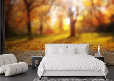 Wooden table with orange leaves autumn background Wall mural