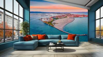 Beautiful summer scenery. Breathtaking summer view  from flying drone of public beach of Grado port, small town located between Venice and Trieste. Magnificent evening seascape of Adriatic sea. Wall mural