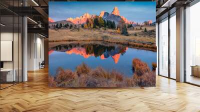 Cimon della Pala peak reflected in the calm waters of small mountain lake. Stunning autumn view of Dolomite Alps. Colorful evening scene of Italy, Europe. Traveling concept background. Wall mural