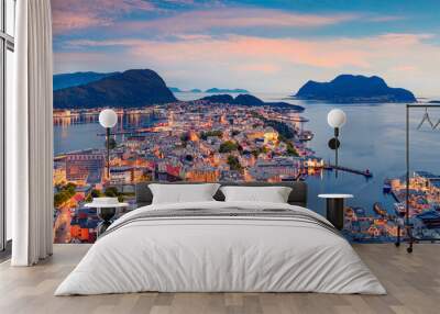 From the bird's eye view of Alesund port town on the west coast of Norway, at the entrance to the Geirangerfjord. Colorful sunset in the Nord. Traveling concept background. Wall mural