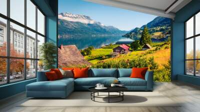 Sunny summer scene in Lofthus village, Hordaland county, Norway. Great morning view of Hardangerfjord fjord. Beauty of countryside concept background. Wall mural