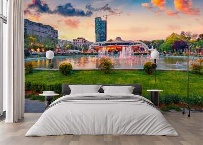 Wonderful spring view of Scanderbeg Square with illuminated fountain. Beautiful sunset in capital of Albania - Tirana. Traveling concept background. Wall mural