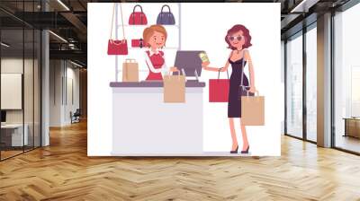 Woman paying for shopping Wall mural