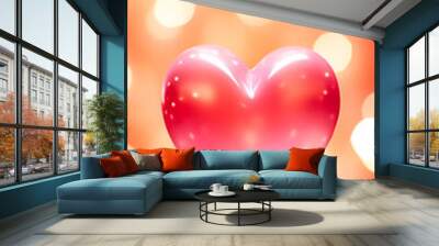 A shiny pink heart on a pink and orange bokeh background with bokeh lights scattered throughout. Dreamy and romantic feel. St. Valentine's day background. Wall mural