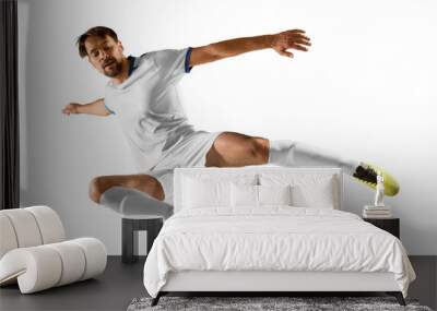 Soccer player in action on white background Wall mural