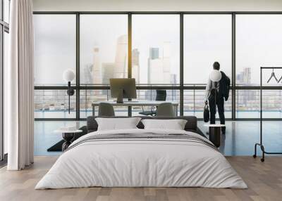 businessman in penthouse office Wall mural