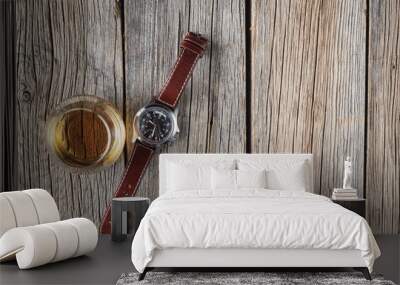 Glass of whisky and watch on wooden texture Wall mural