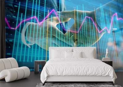 Double exposure of financial chart on cityscape background with two businessmen handshake. Concept of financial analysis and investment opportunities Wall mural