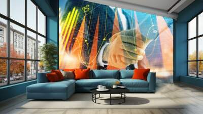 Double exposure of financial chart on cityscape background with two businessmen handshake. Concept of financial analysis and investment opportunities Wall mural