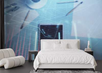 Double exposure of forex graph on digital tablet laying on table background. Concept of market analysis Wall mural