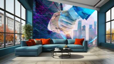 Double exposure of world map on cityscape background with two businessmen handshake. Concept of international business Wall mural