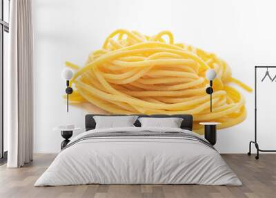 Fresh uncooked spaghetti pasta isolated on a white background Wall mural