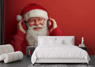 funny santa claus wearing headphones and enjoying music Wall mural