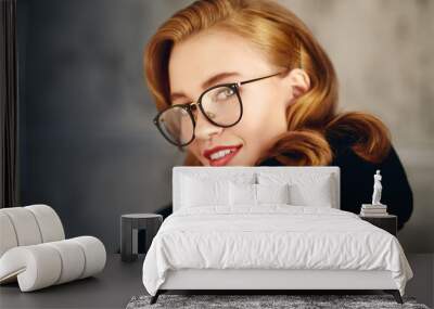 smiling girl in glasses Wall mural