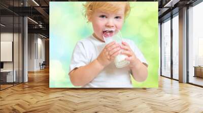 Child drinking dairy product from glass Wall mural