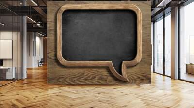 old chalkboard in shape of speech bubble on wooden background Wall mural