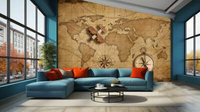 Small wood airplane over world nautical map as travel and communication concept Wall mural