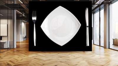 square white plate fork and knife isolated on black background Wall mural