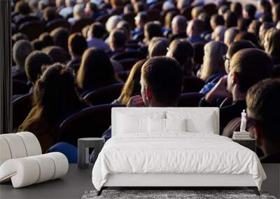 People in the auditorium during the performance. A theatrical production. Wall mural