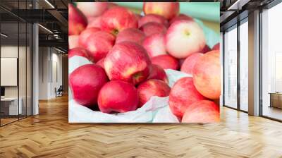 Red ripe apples on the counter of the street market. Wall mural