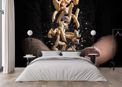 Making pasta with flour on a black background with a spatial area. Italian Food banner Wall mural