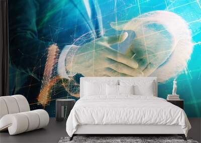 Multi exposure of bitcoin sign on abstract background with two men handshake. Concept of cryptocurrency Wall mural