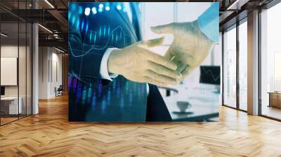 Multi exposure of financial graph on office background with two businessmen handshake. Concept of success in business Wall mural