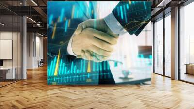 Multi exposure of financial graph on office background with two businessmen handshake. Concept of success in business Wall mural