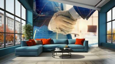 Multi exposure of financial graph on office background with two businessmen handshake. Concept of success in business Wall mural