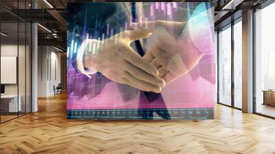 Multi exposure of forex graph on abstract background with two businessmen handshake. Concept of success on stock market Wall mural