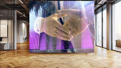 Multi exposure of forex graph on abstract background with two businessmen handshake. Concept of success on stock market Wall mural