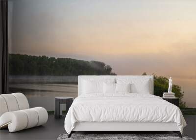 Fog over the river at dawn. Wall mural