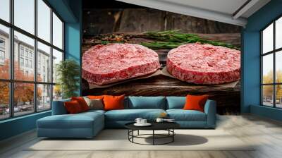 Organic frozen raw minced meat or beef cutlets on a wooden Board  Wall mural