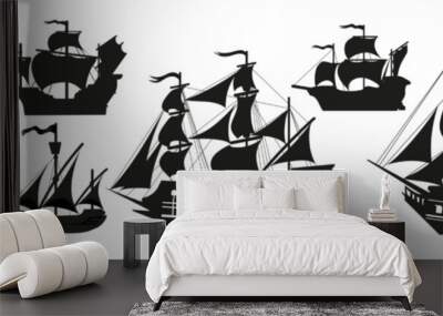 Pirate boats and Old different Wooden Ships with Fluttering Flags. Vector Set Old shipping sails traditional vessel pirate symbols garish vector illustrations.Black silhouettes collection set Wall mural