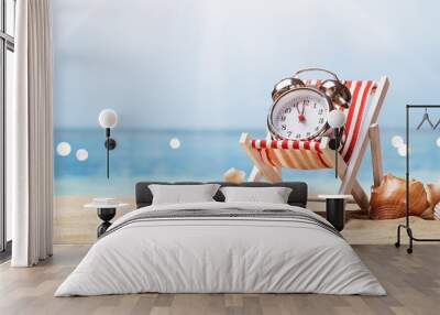 Alarm Clock On Deck Chair On Beach Wall mural