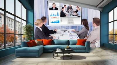 Business People In Video Conference At Table Wall mural