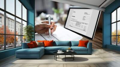 Businessman's Hands Working On Invoice On Laptop Wall mural