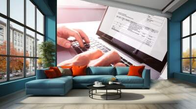 Businessman's Hands Working On Invoice On Laptop Wall mural