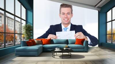 Businessman Holding Cheque Wall mural