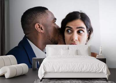 Businessman Whispering Into Female Partner's Ear Wall mural