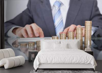 businessman with keyboard and coin stack Wall mural