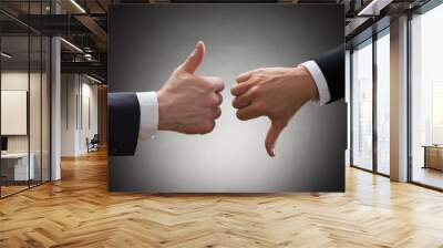 businesspeople hands showing thumb up and thumb down Wall mural