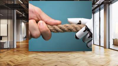 Businessperson And Robot Playing Tug Of War Wall mural