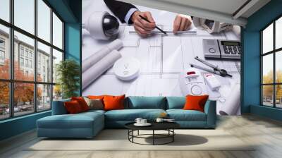 Close-up Of An Architect's Hand Drawing Blueprint Wall mural