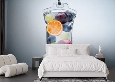 Different Fruit Slices Inside Saline Bag Hanging In Hospital Wall mural