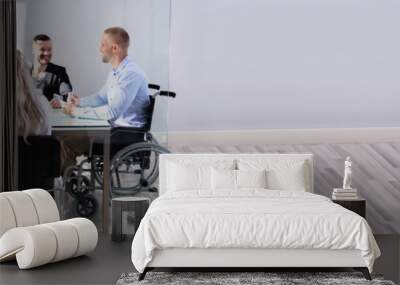 Disabled Manager Sitting With His Colleagues Wall mural