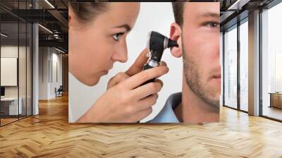 Doctor Examining Man's Ear Wall mural