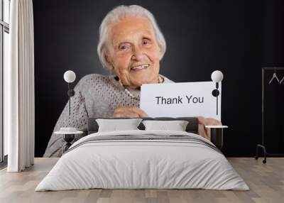 Elder Woman Showing Thank You Card Wall mural