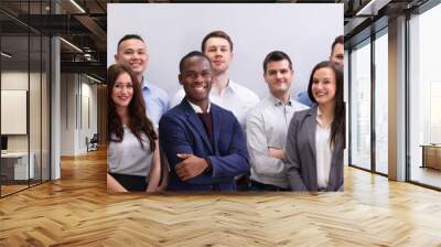 Group Of Smiling Businesspeople Standing In Office Wall mural